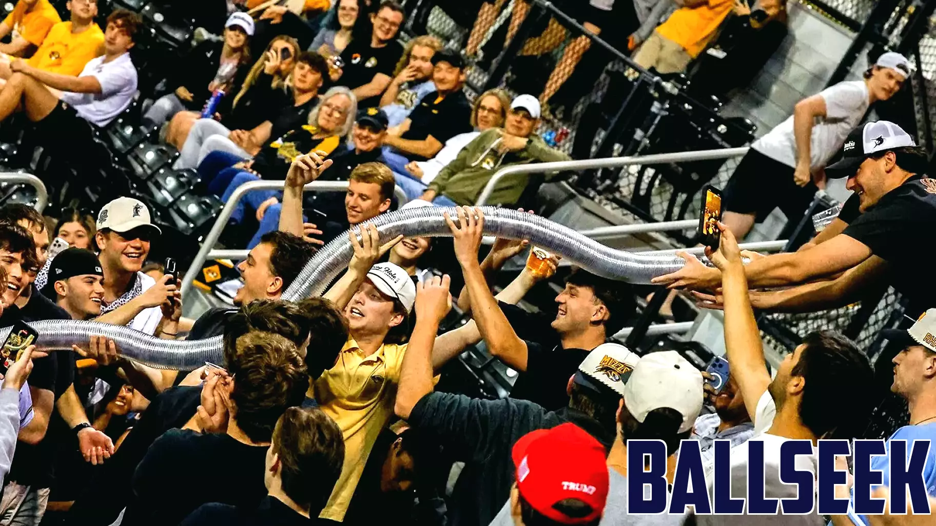 Fans build a cup snake during the game